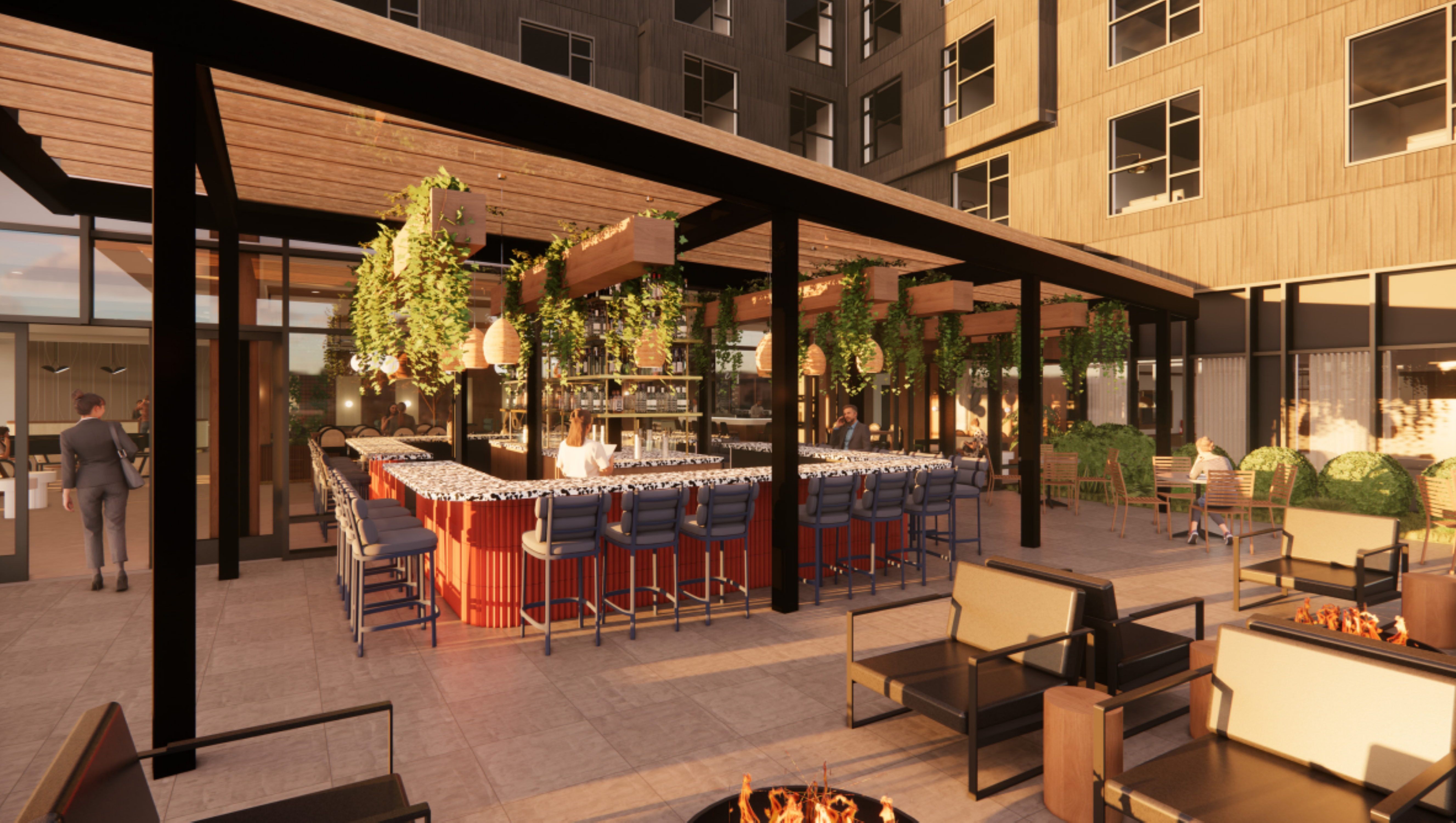 Nashville's vibrant outdoor bar features a red counter encircled by blue chairs, all nestled under a pergola adorned with hanging plants. Fire pits and a cozy seating area beckon in the foreground, while the backdrop is dominated by a sleek, modern building.