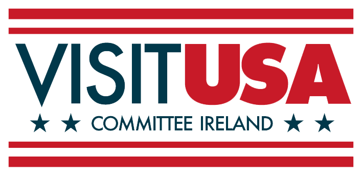 Logo with the text "VISIT USA COMMITTEE IRELAND" in bold letters, bordered by red stripes and stars on a white background, highlighting What's New in Nashville for 2025.