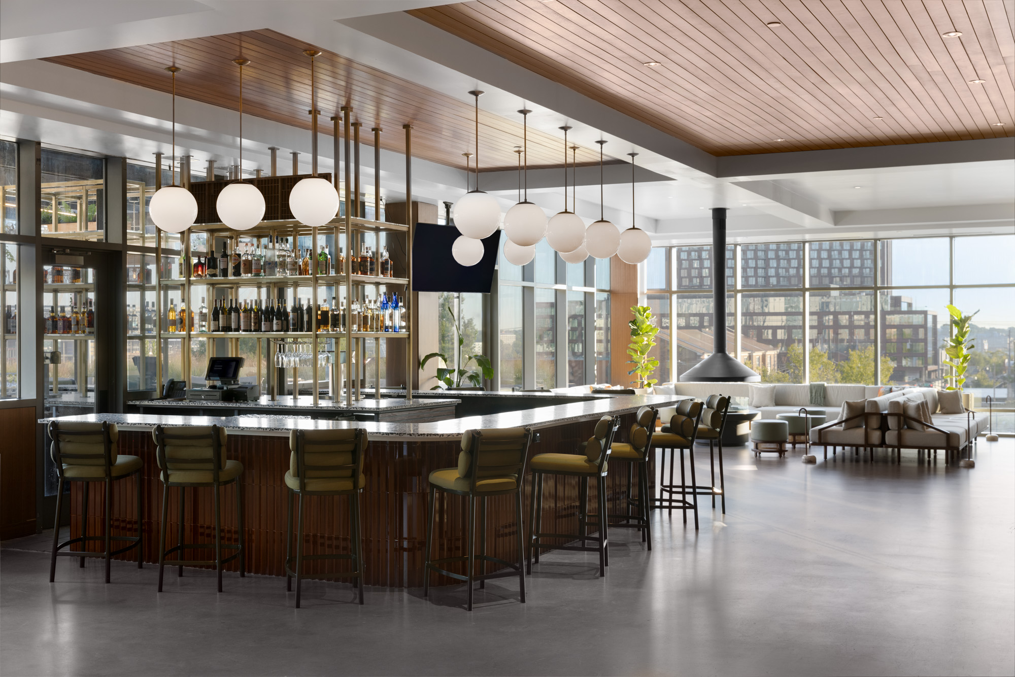 Modern Nashville hotel bar with warm lighting, and stylish seating at The Printing House, showcasing one of the top Nashville hotel bars and a popular choice for travelers seeking hotels with bars in Nashville, TN