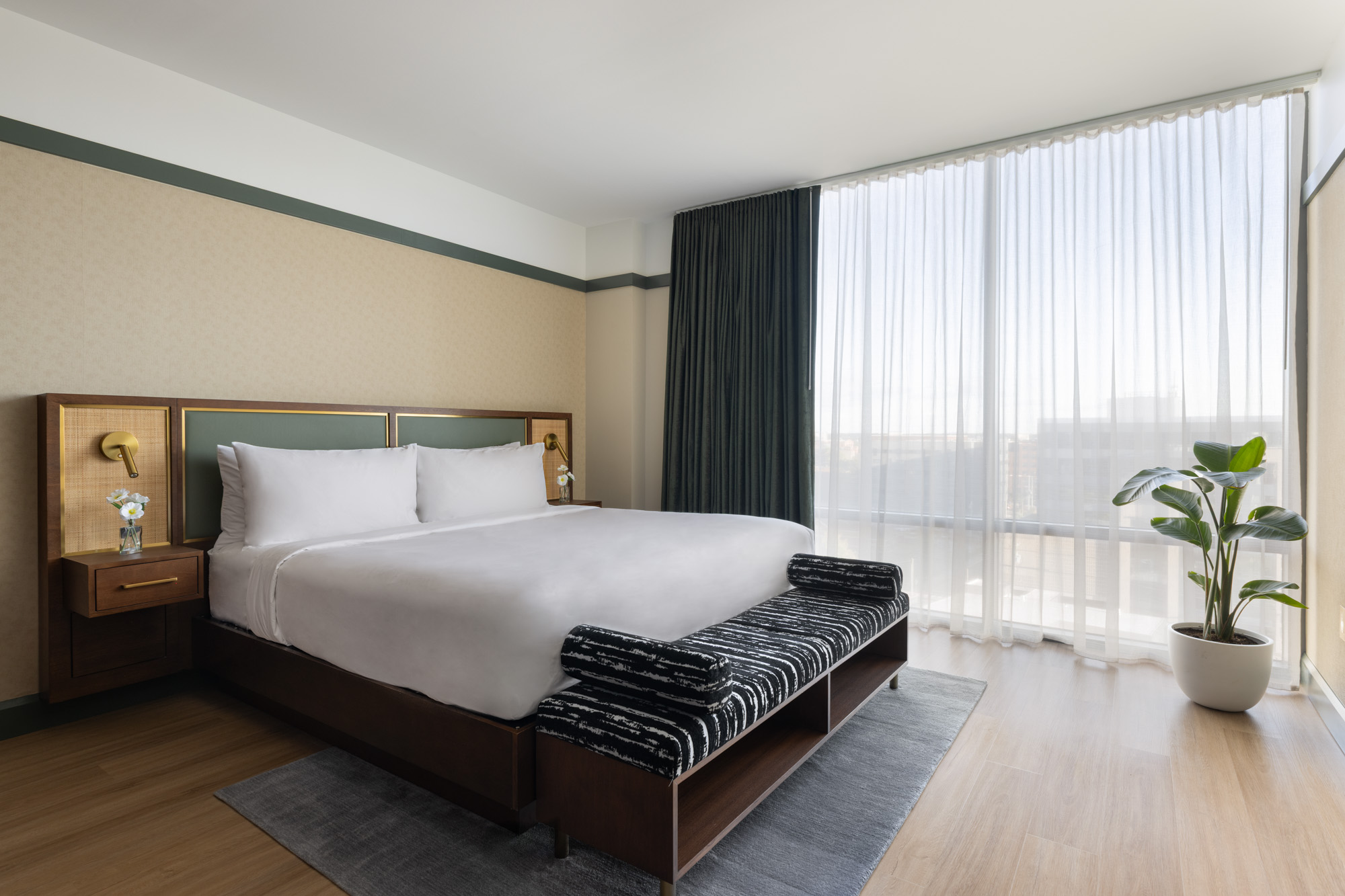 King bed hotel room with contemporary furnishings, soft lighting, and a clean, inviting layout at The Printing House